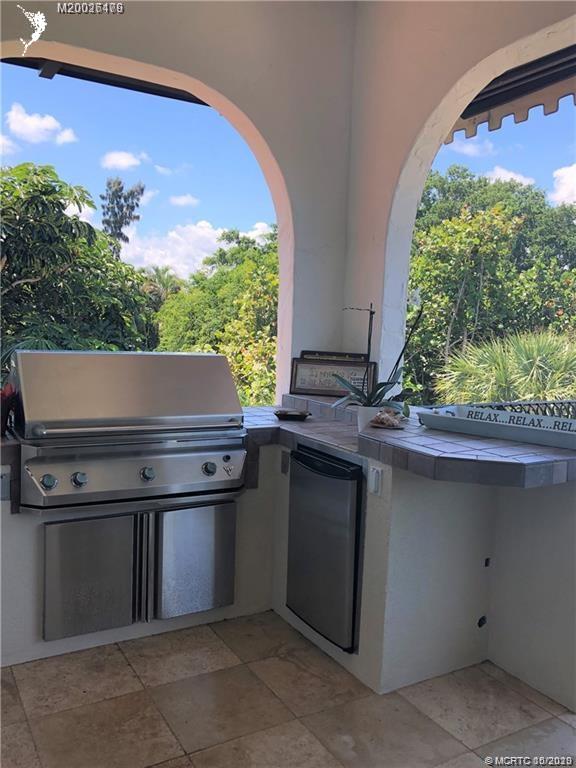 15 Middle Road Stuart, FL 34996 - Photo 16 of 28 a kitchen with a stove and a microwave