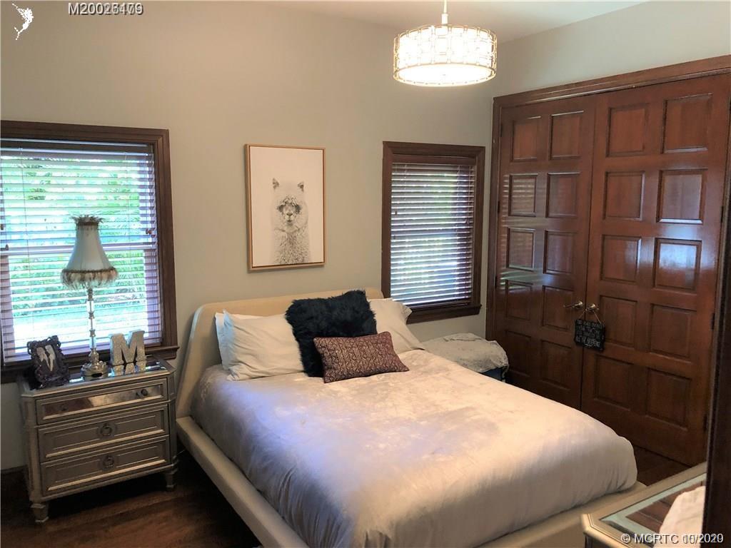 15 Middle Road Stuart, FL 34996 - Photo 17 of 28 a bedroom with a bed and a window