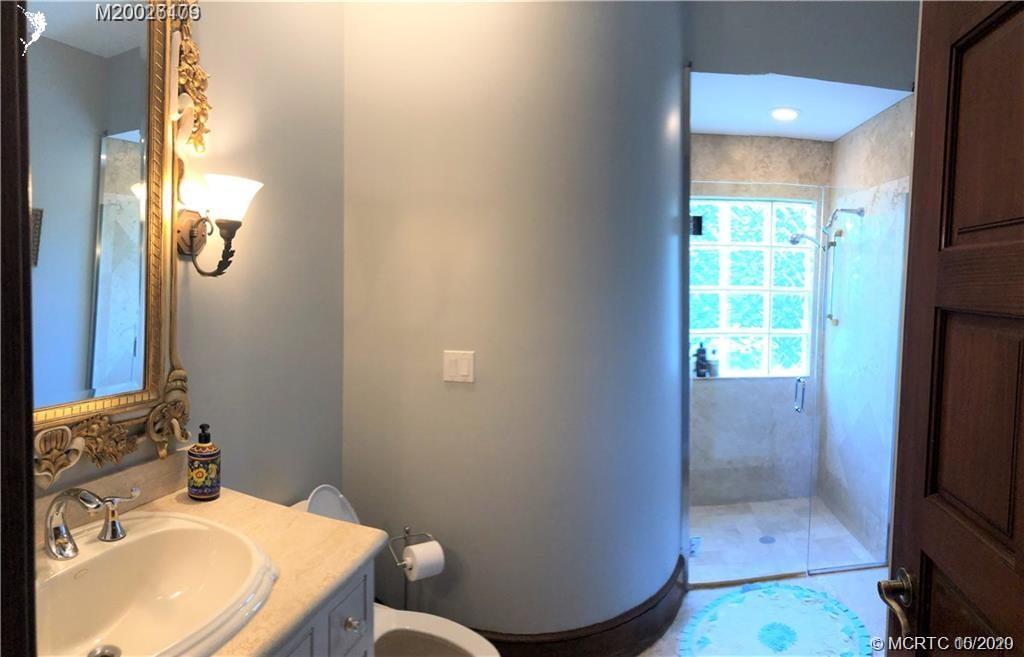15 Middle Road Stuart, FL 34996 - Photo 19 of 28 a bathroom with a sink toilet and shower
