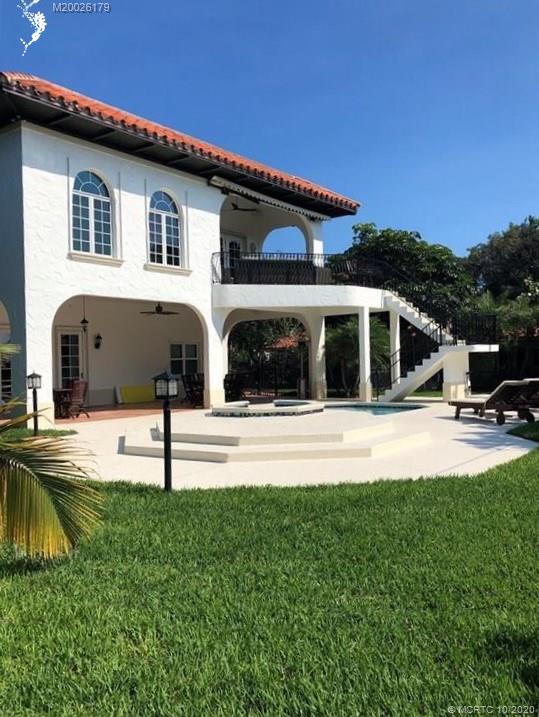 15 Middle Road Stuart, FL 34996 - Photo 24 of 28 a view of house and outdoor space with swimming pool