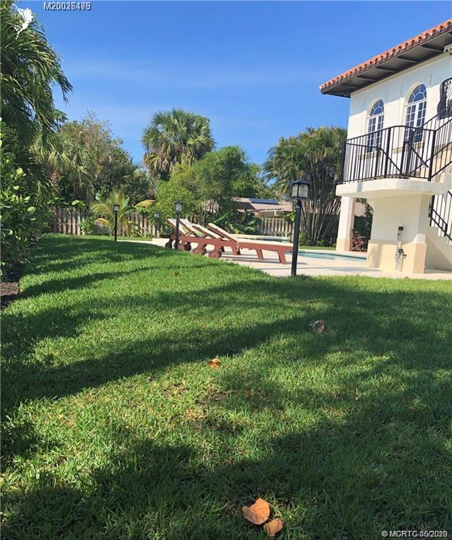 15 Middle Road Stuart, FL 34996 - Photo 25 of 28 a view of a house with a backyard