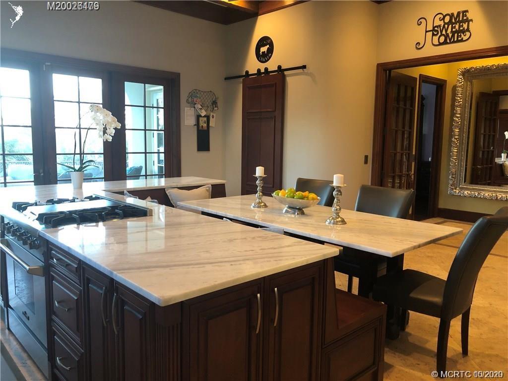 15 Middle Road Stuart, FL 34996 - Photo 26 of 28 a dining table with chairs and window