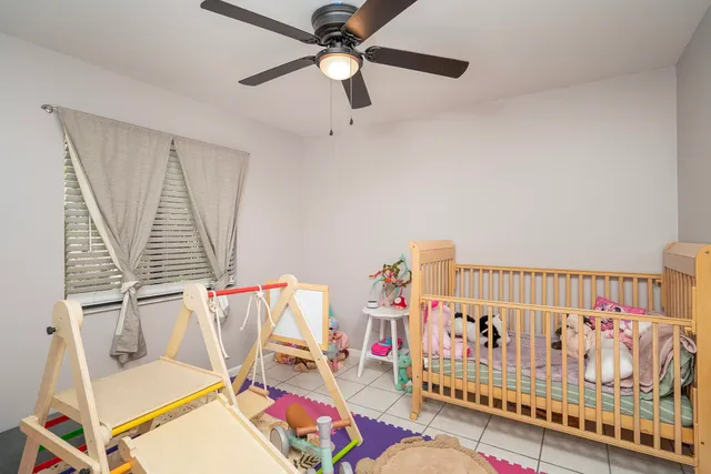 a living room with lots of baby furniture