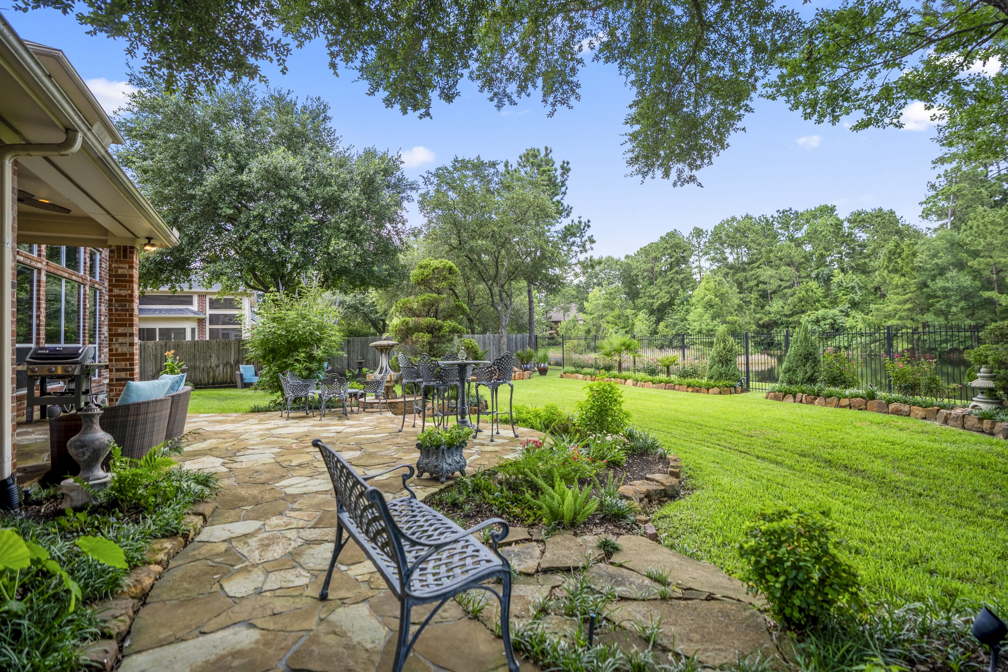 67 North Pentenwell Circle Spring, TX 77382 - Photo 40 of 50 a view of a chair and table in backyard of the house