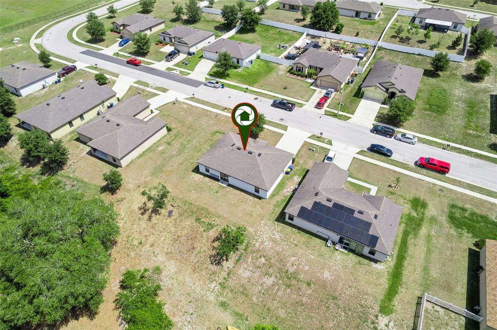 1613 Orne Street Mascotte, FL 34753 - Photo 28 of 31 an aerial view of residential houses with outdoor space