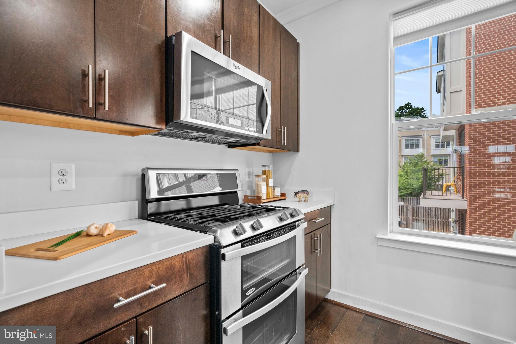 3334 7th Street Northeast Washington, DC 20017 - Photo 12 of 38 a kitchen with stainless steel appliances a stove a microwave and a window