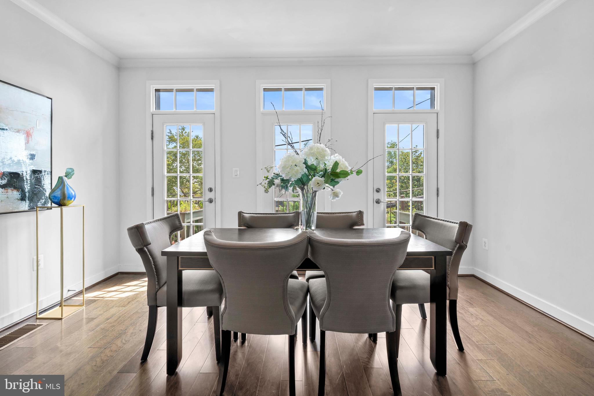 3334 7th Street Northeast Washington, DC 20017 - Photo 16 of 38 a view of a dining room with furniture and a potted plant