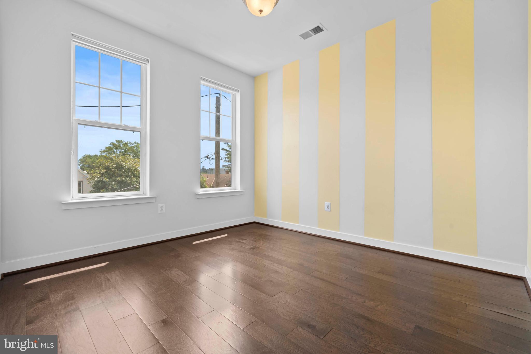 3334 7th Street Northeast Washington, DC 20017 - Photo 25 of 38 an empty room with wooden floor and windows