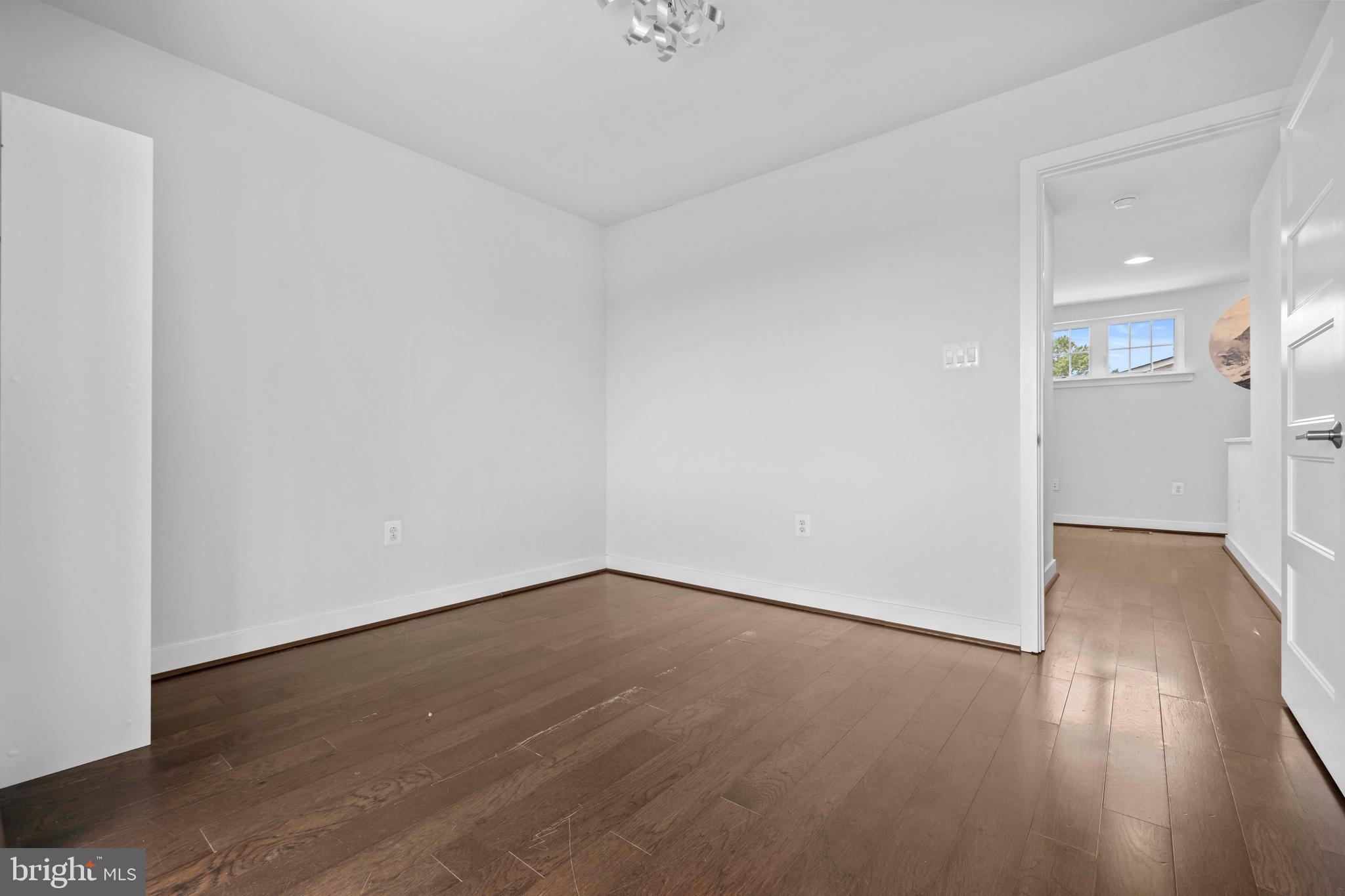 3334 7th Street Northeast Washington, DC 20017 - Photo 31 of 38 a view of an empty room with wooden floor