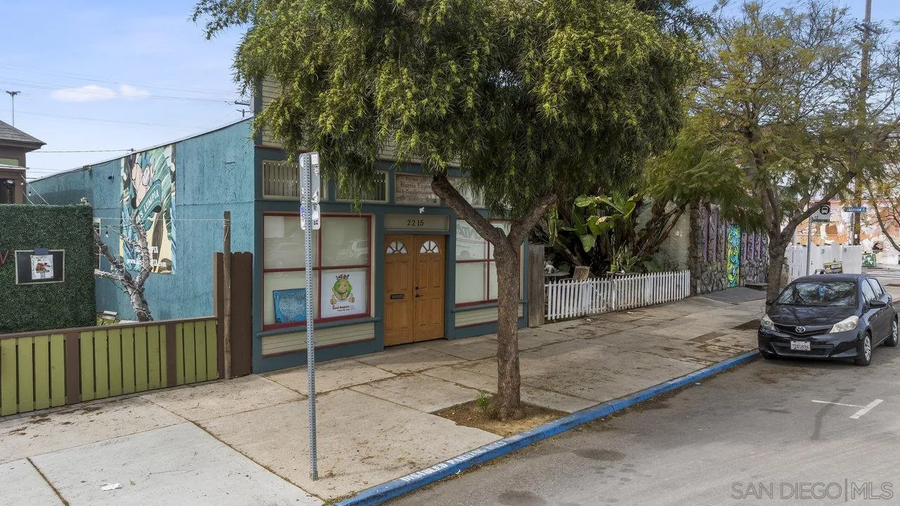 2215 Logan Avenue San Diego, CA 92113 - Photo 4 of 17 a view of a car park in front of a house