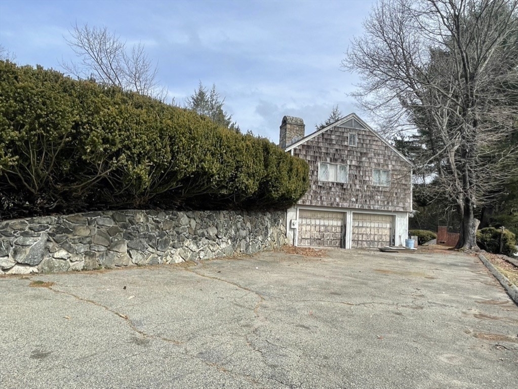53 Crestview Road Belmont, MA 02478 - Photo 6 of 8 a front view of a house with a yard