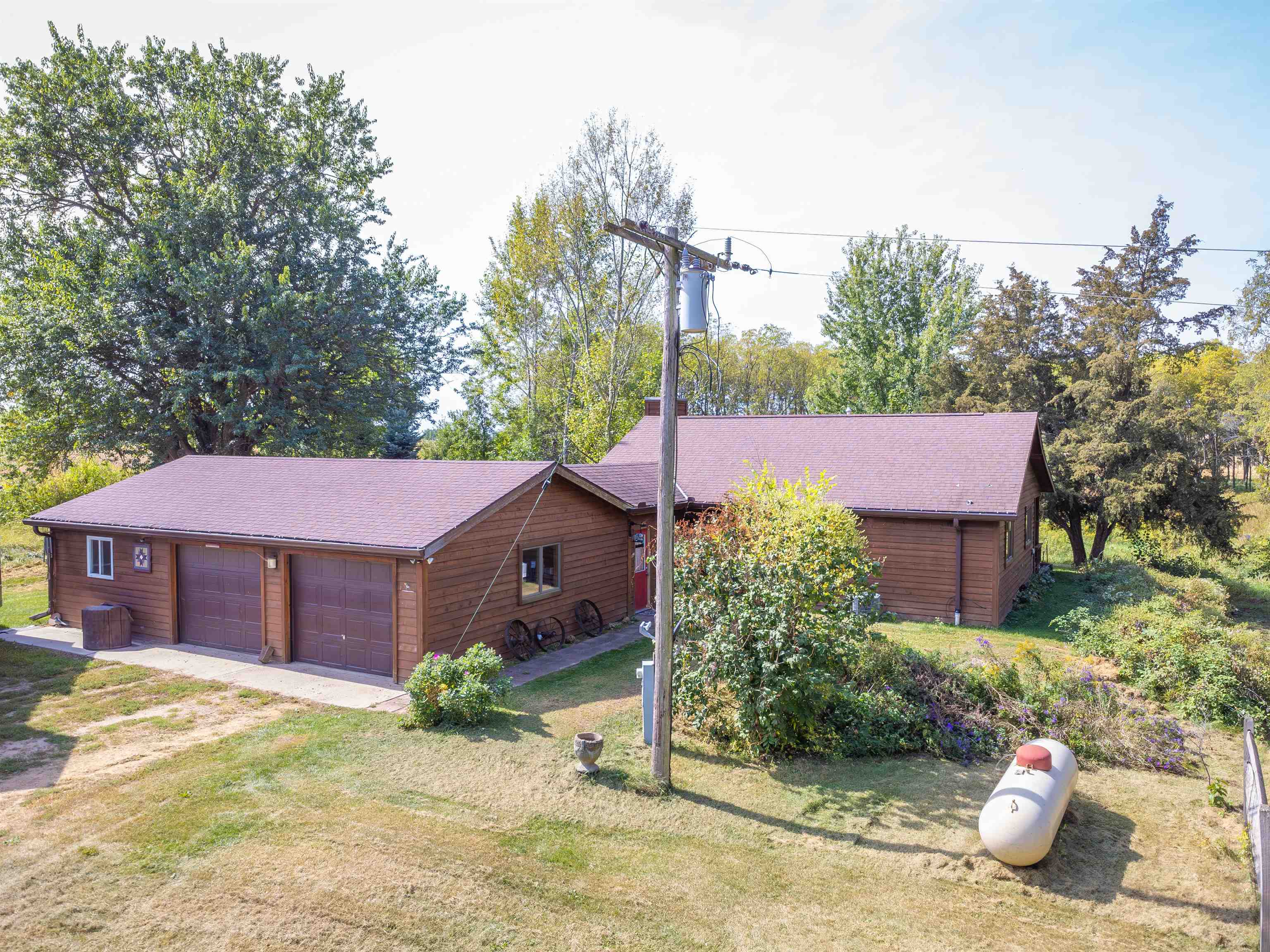 17065 Highway 64 Polo, IL 61064 - Photo 22 of 26 a front view of a house with a yard