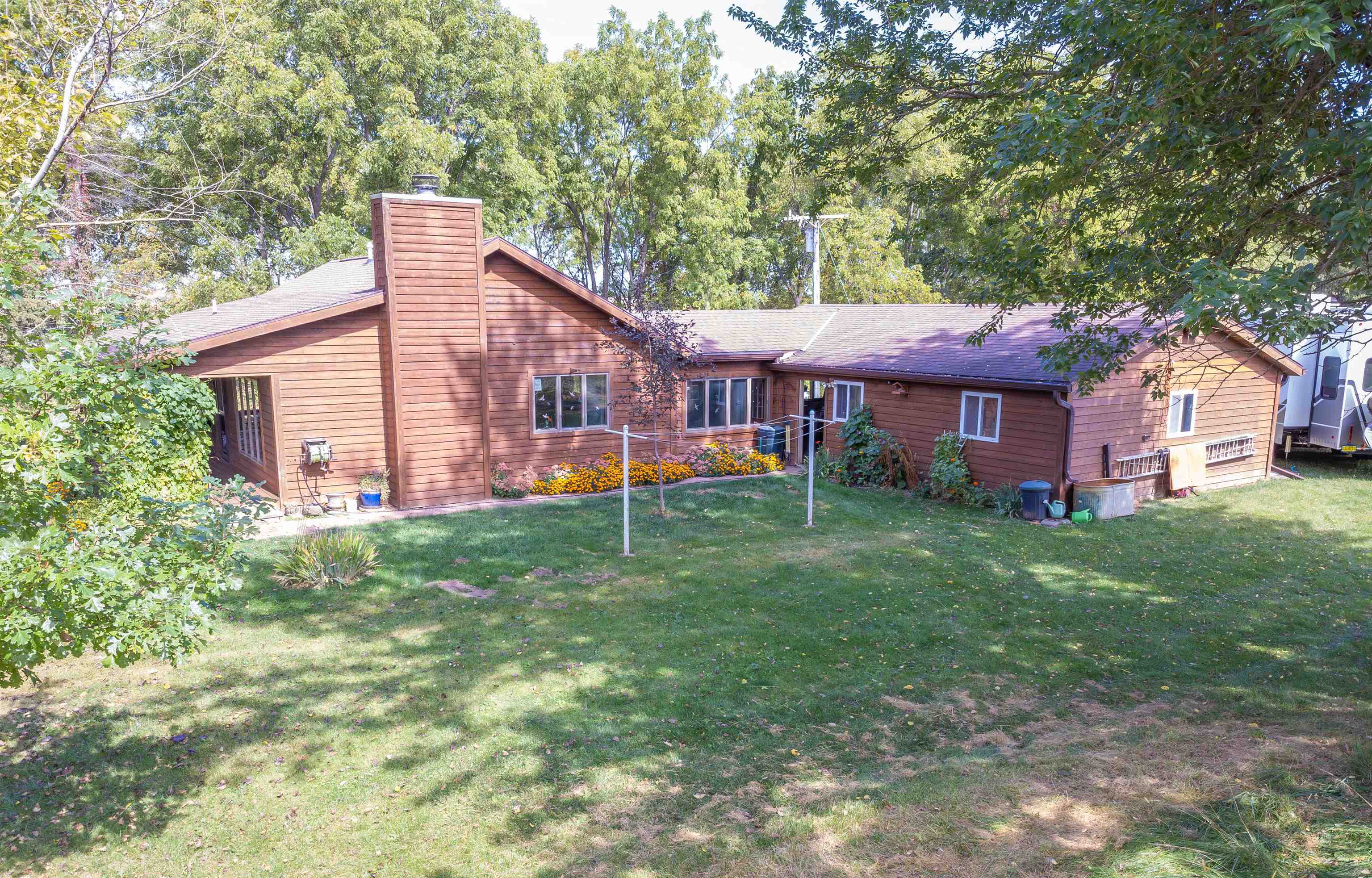 17065 Highway 64 Polo, IL 61064 - Photo 23 of 26 a front view of a house with garden