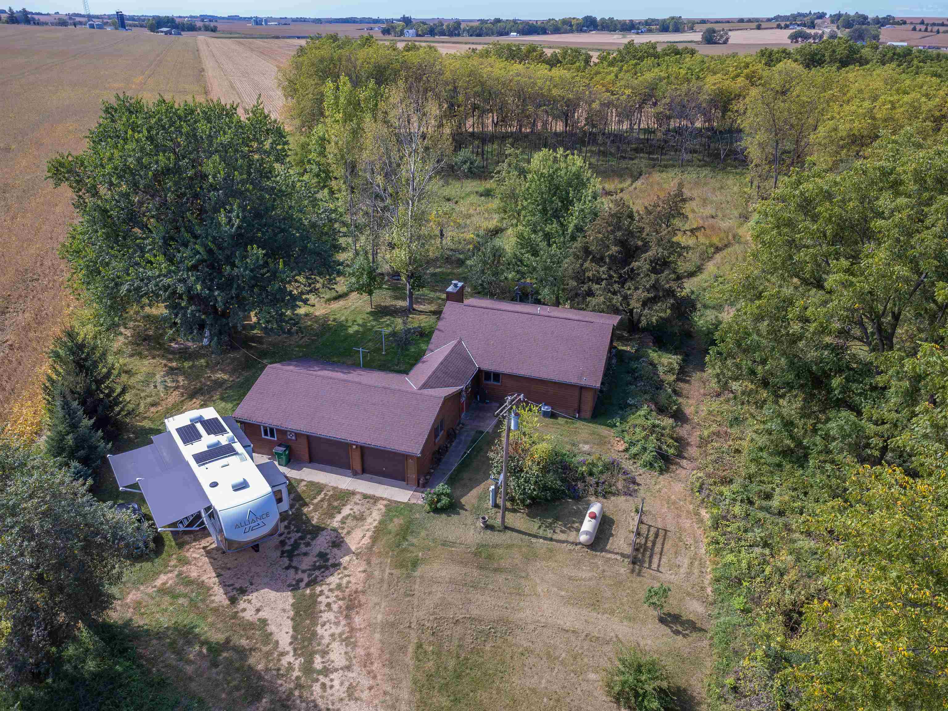17065 Highway 64 Polo, IL 61064 - Photo 24 of 26 an aerial view of a house with garden space and lake view
