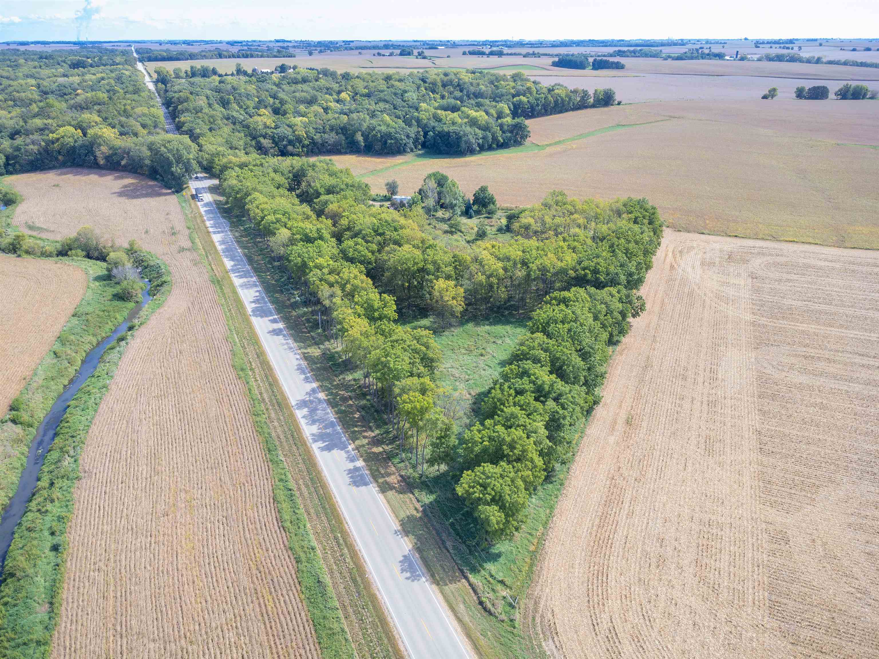 17065 Highway 64 Polo, IL 61064 - Photo 25 of 26 a view of a lake with a mountain