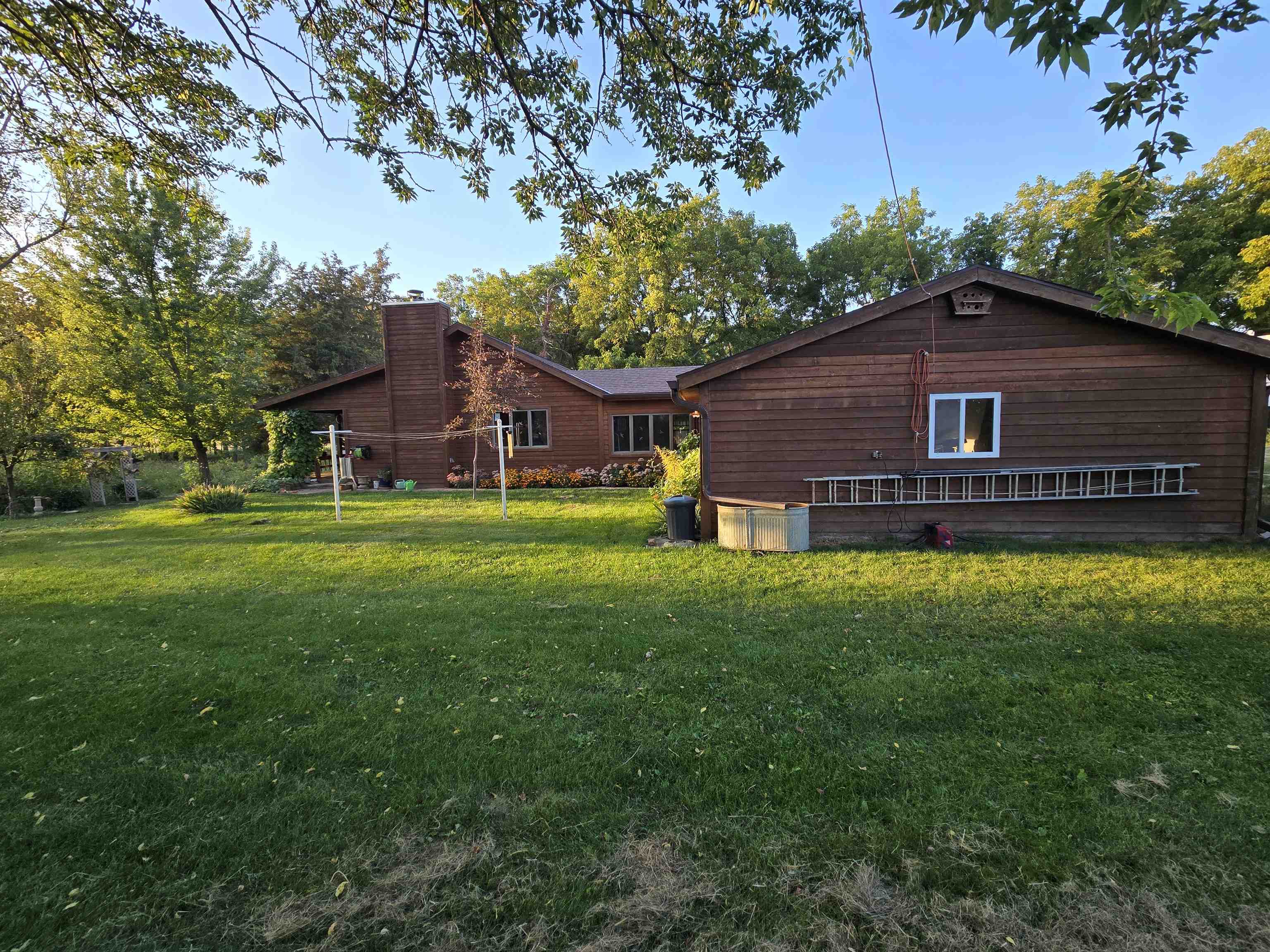 17065 Highway 64 Polo, IL 61064 - Photo 3 of 26 a view of a house with a yard