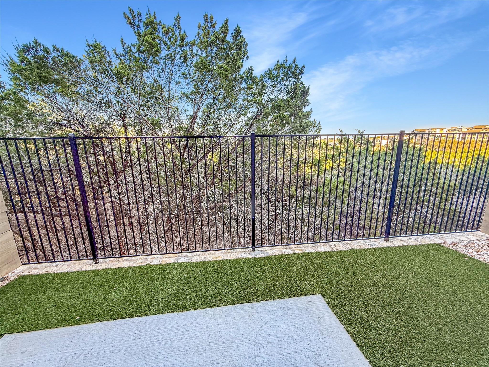 5609 Mobeetie Loop Bee Cave, TX 78738 - Photo 6 of 23 backyard with turf