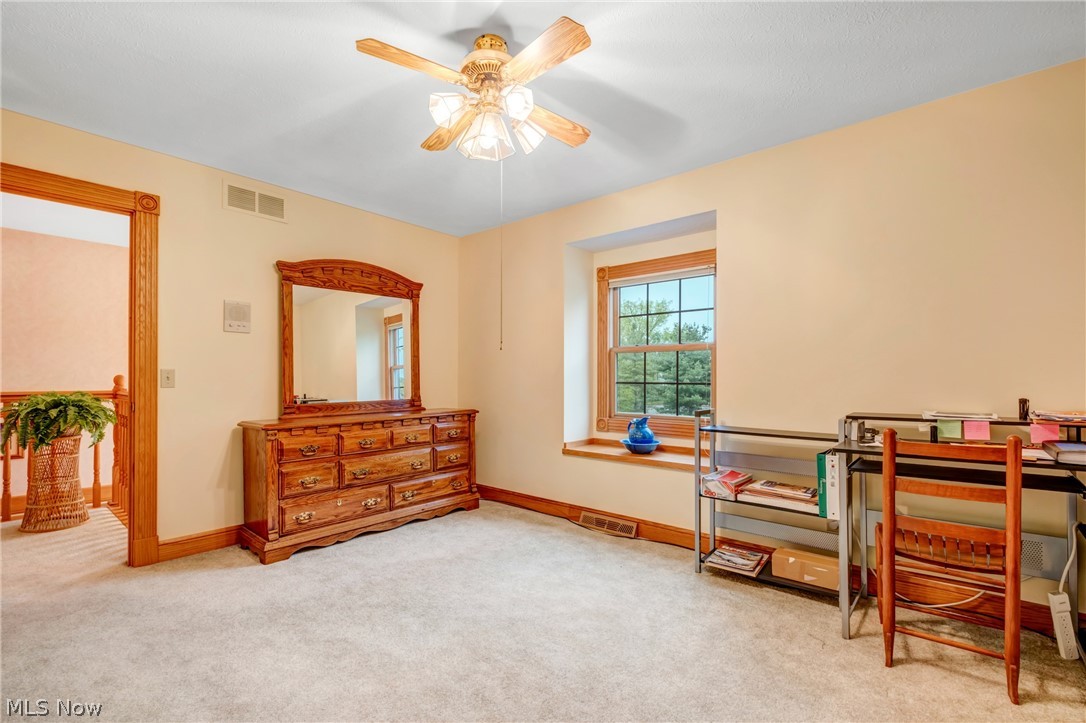 2645 Frost Road Mantua, OH 44255 - Photo 26 of 35 Fourth bedroom ceiling fan closet carpet (hardwood) now used as an office