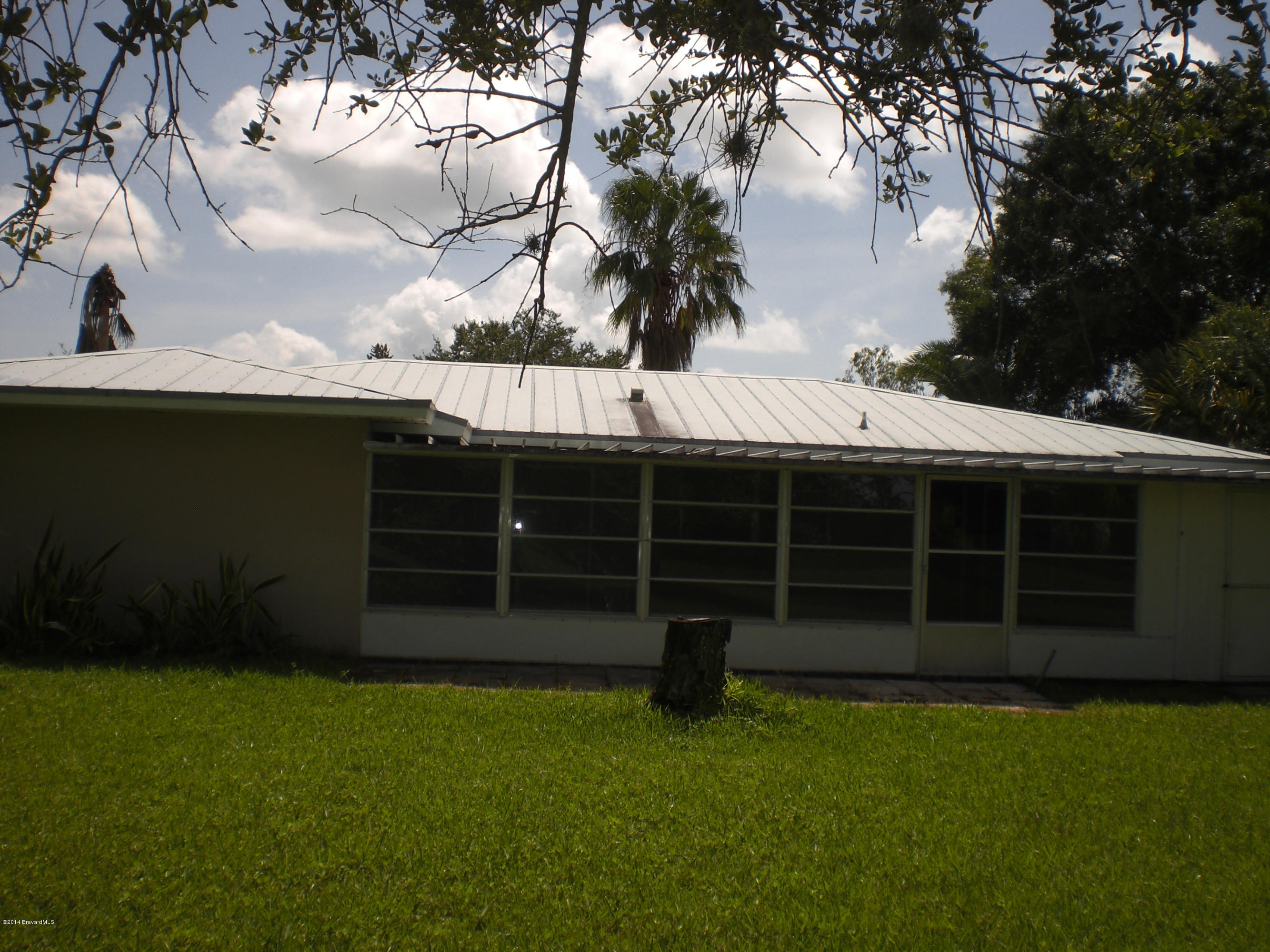 1180 Cotton Road Northeast Palm Bay, FL 32905 - Photo 16 of 18 a view of a backyard