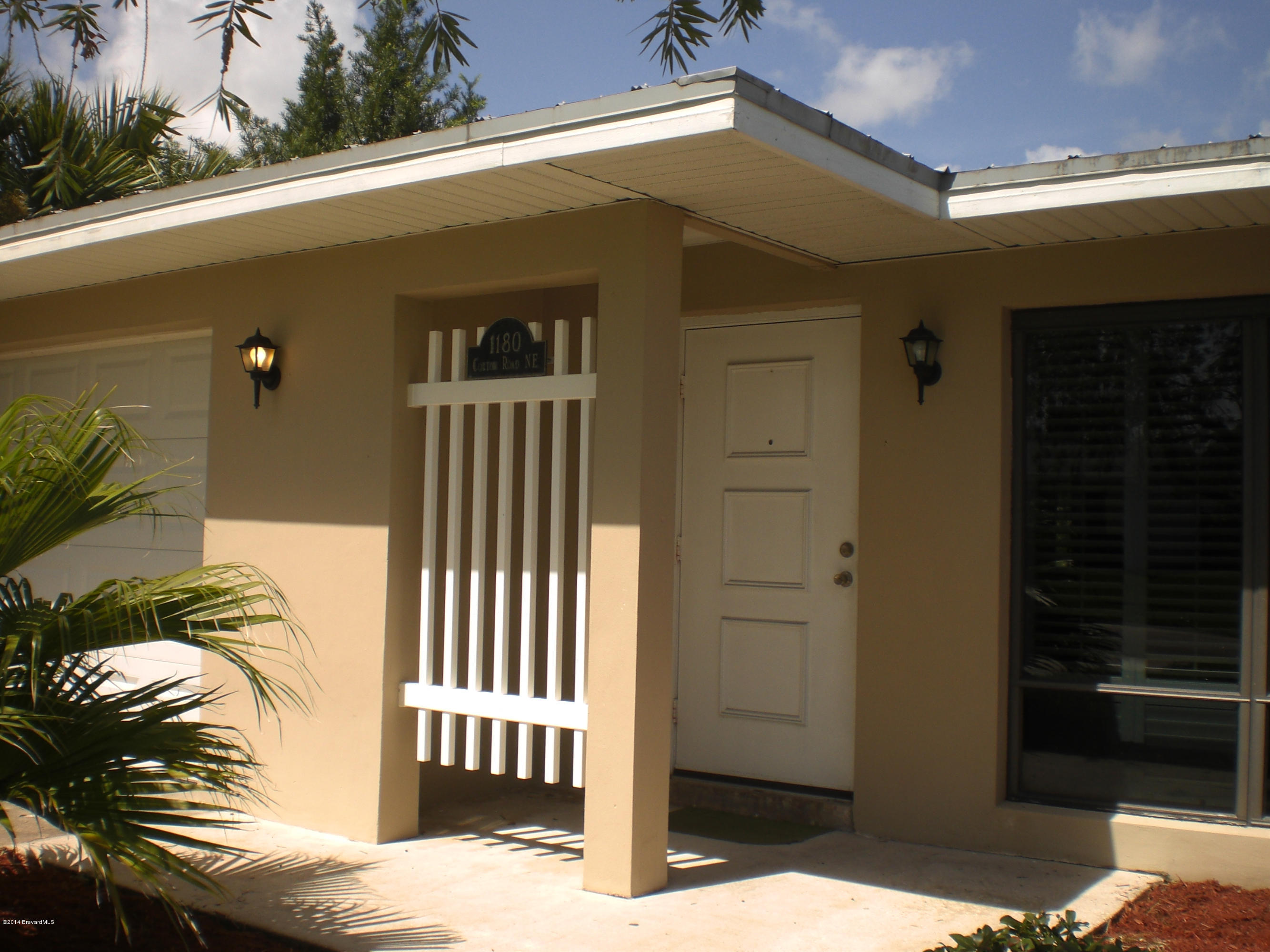 1180 Cotton Road Northeast Palm Bay, FL 32905 - Photo 3 of 18 a view of a house with a door