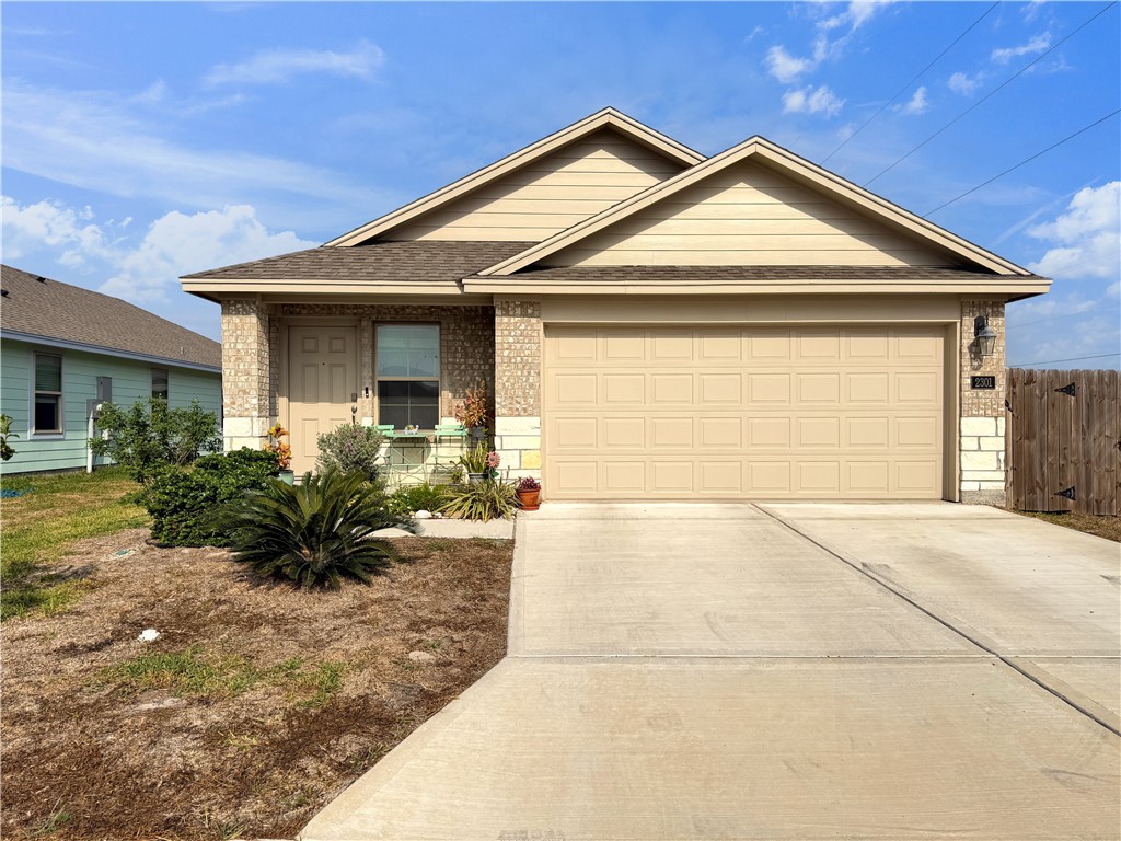 2301 Soothing Street Corpus Christi, TX 78418 - Photo 1 of 25 a front view of a house with a yard