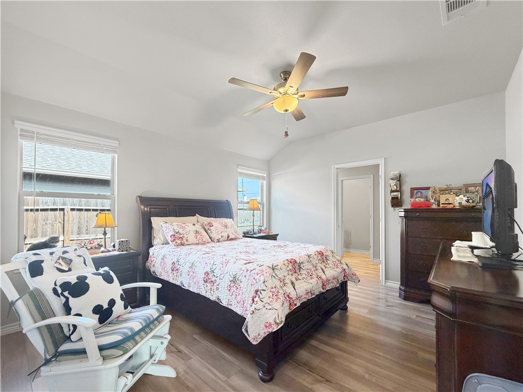 2301 Soothing Street Corpus Christi, TX 78418 - Photo 14 of 25 a bedroom with a bed and a couch