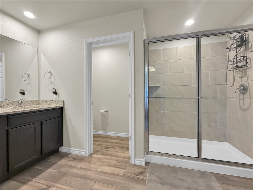 2301 Soothing Street Corpus Christi, TX 78418 - Photo 16 of 25 a bathroom with a shower and a sink