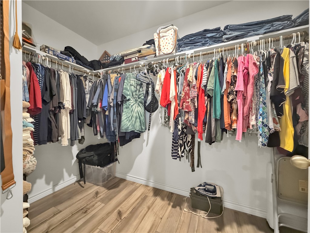 2301 Soothing Street Corpus Christi, TX 78418 - Photo 17 of 25 a view of walk in closet with clothes