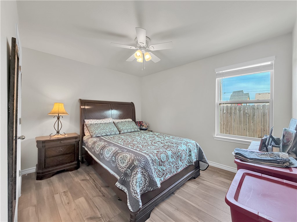 2301 Soothing Street Corpus Christi, TX 78418 - Photo 18 of 25 a bedroom with a bed and window