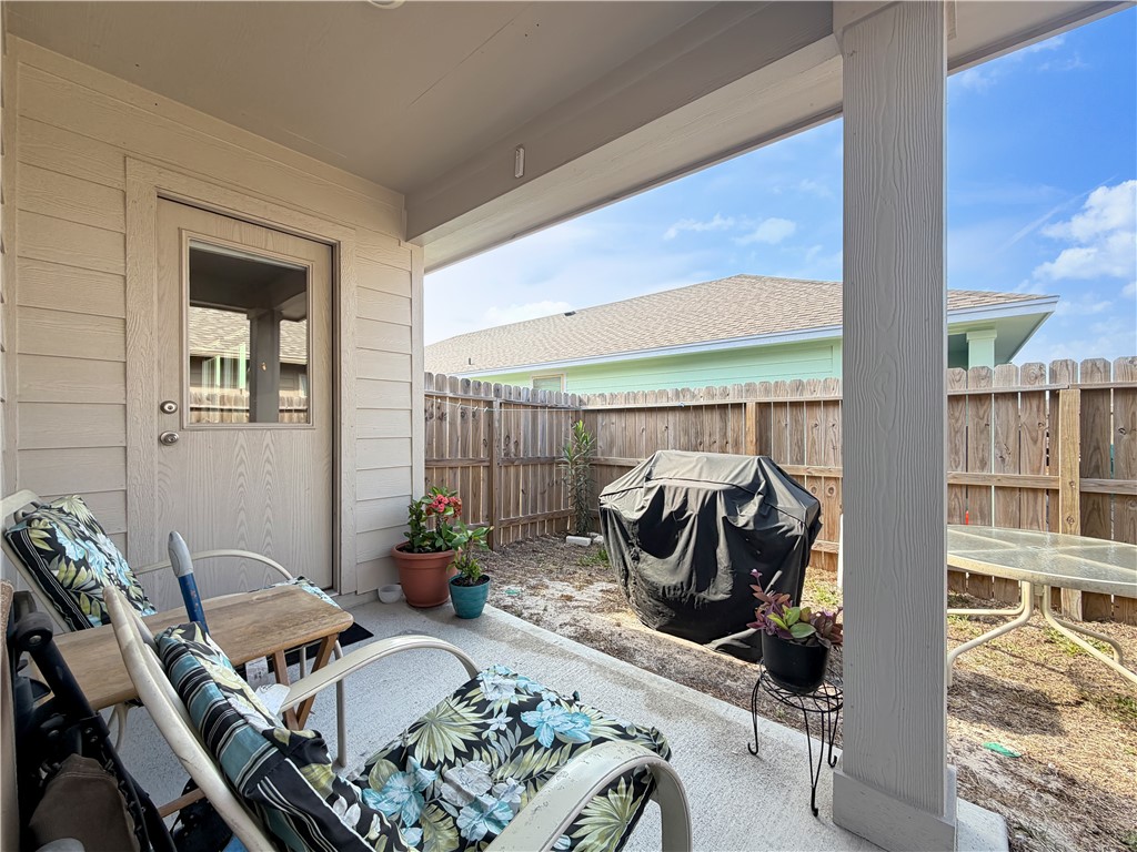 2301 Soothing Street Corpus Christi, TX 78418 - Photo 23 of 25 a living room with furniture and floor to ceiling windows