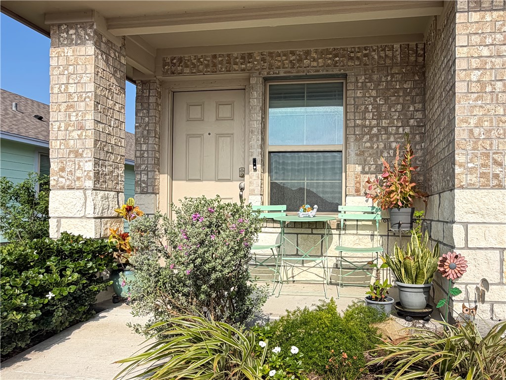 2301 Soothing Street Corpus Christi, TX 78418 - Photo 3 of 25 a view of house with backyard outdoor seating and plants