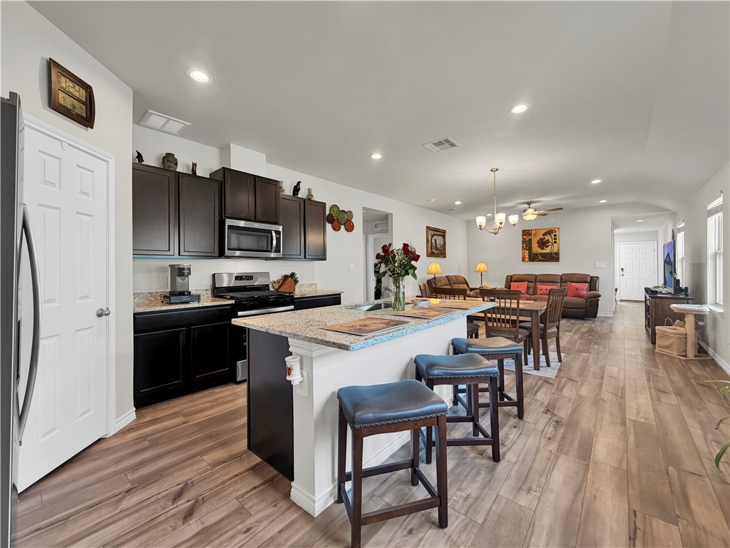 2301 Soothing Street Corpus Christi, TX 78418 - Photo 10 of 25 a large kitchen with a table and chairs
