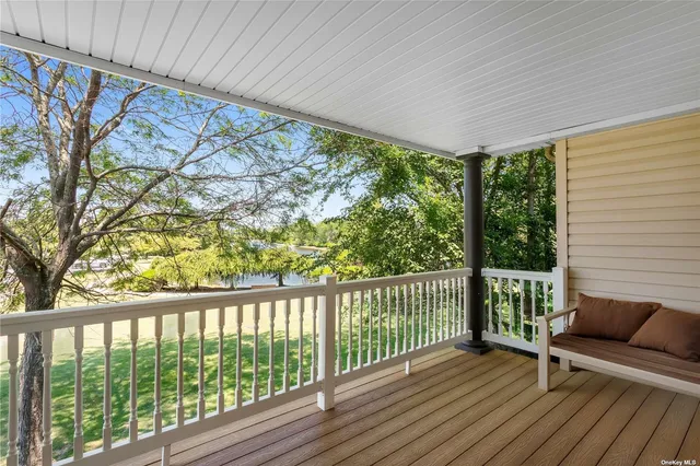 a view of a two chairs in the balcony