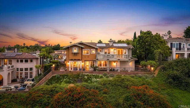 an aerial view of residential houses with outdoor space and street view