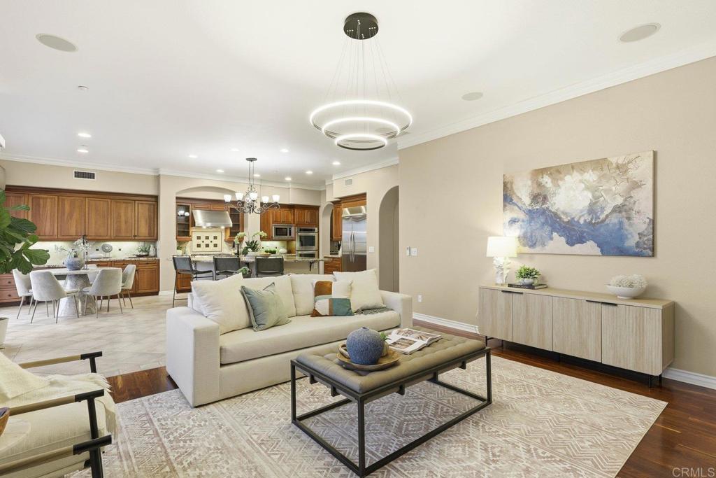 1375 Ravean Court Encinitas, CA 92024 - Photo 15 of 75 a living room with furniture kitchen view and a wooden floor
