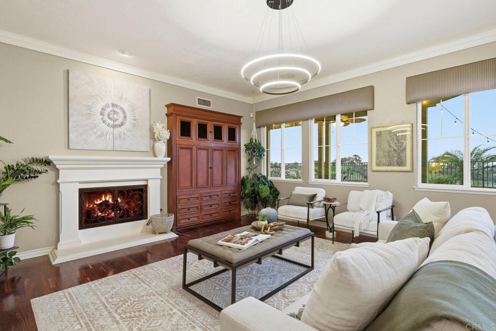 1375 Ravean Court Encinitas, CA 92024 - Photo 17 of 75 a living room with furniture a fireplace and a large window