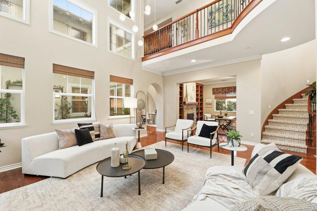 1375 Ravean Court Encinitas, CA 92024 - Photo 37 of 75 a living room with furniture or couch and a large window