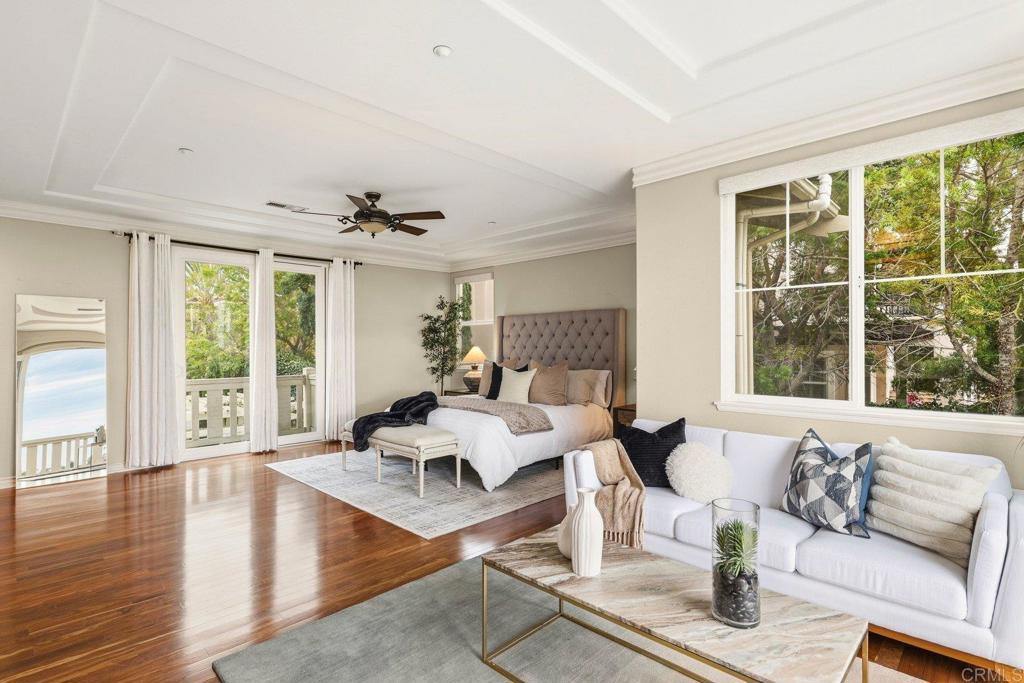 1375 Ravean Court Encinitas, CA 92024 - Photo 45 of 75 a living room with furniture large window and wooden floor