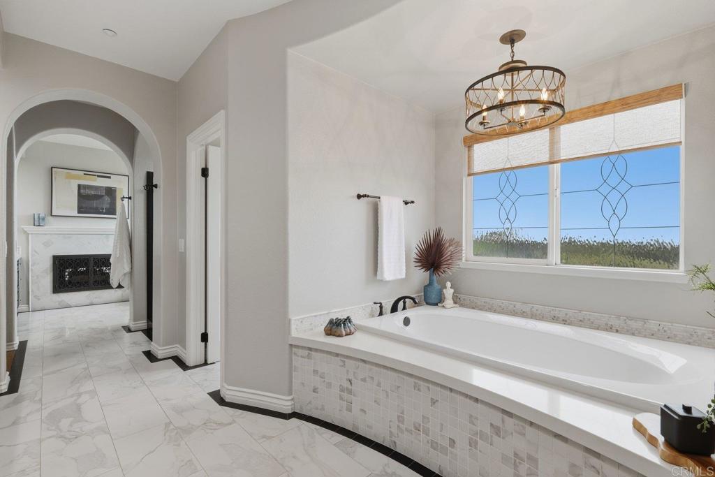 1375 Ravean Court Encinitas, CA 92024 - Photo 53 of 75 a bathroom with a sink and a mirror