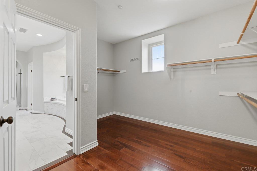 1375 Ravean Court Encinitas, CA 92024 - Photo 54 of 75 a view of an empty room with wooden floor