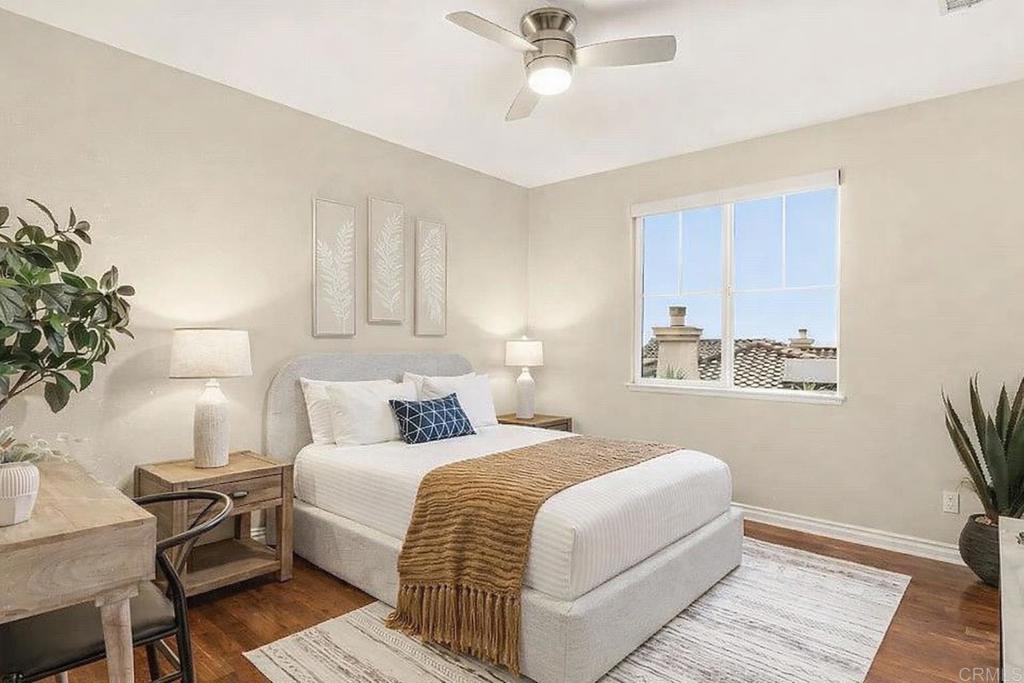 1375 Ravean Court Encinitas, CA 92024 - Photo 60 of 75 a bedroom with a bed and a chandelier