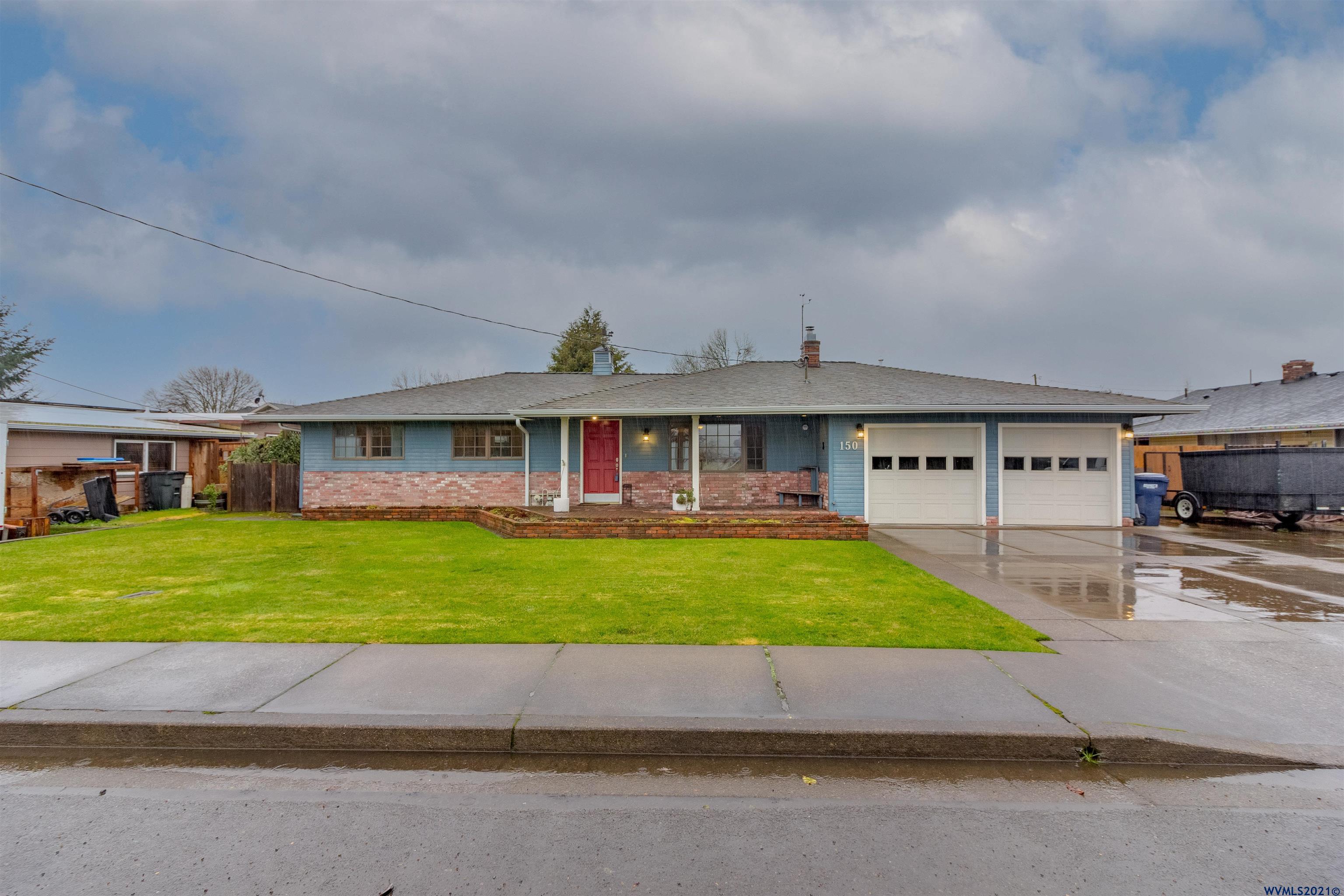 150 Edwards Road South Monmouth, OR 97361 - Photo 1 of 39 a front view of a house with a yard and garage