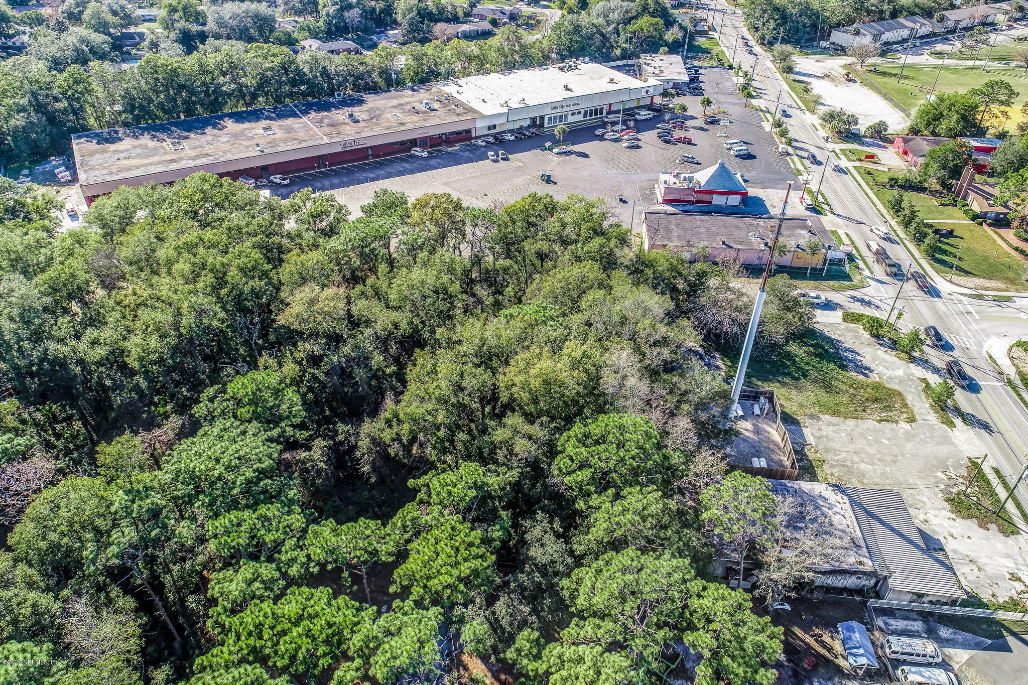 0 Tracy Road Jacksonville, FL 32211 - Photo 7 of 13 an aerial view of a red and white house with a yard and garden in the back
