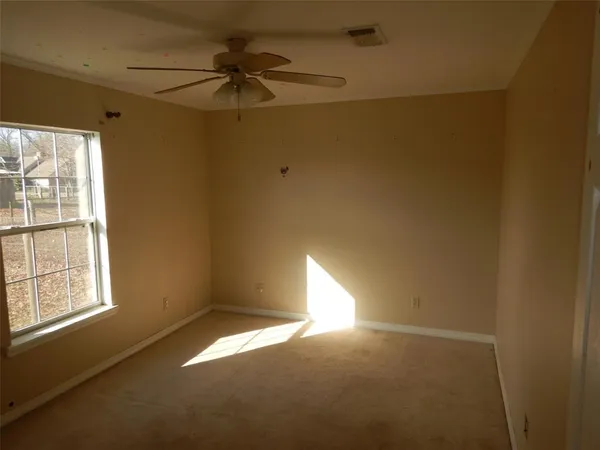 a view of empty room with windows