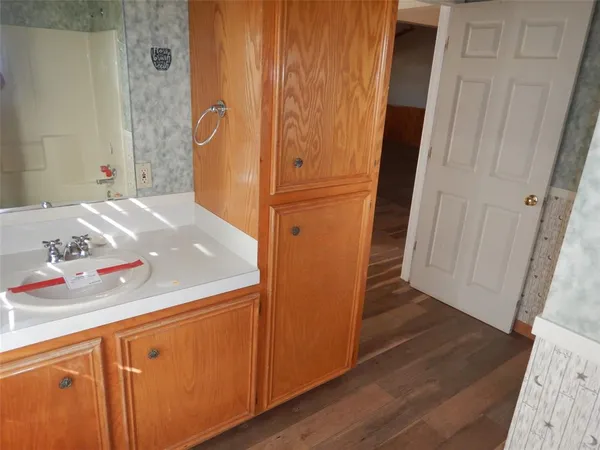 a bathroom with a tub and shower