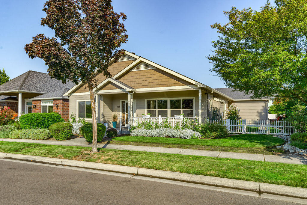 1034 Buck Point Street Central Point, OR 97502 - Photo 1 of 43 a front view of a house with a yard and potted plants