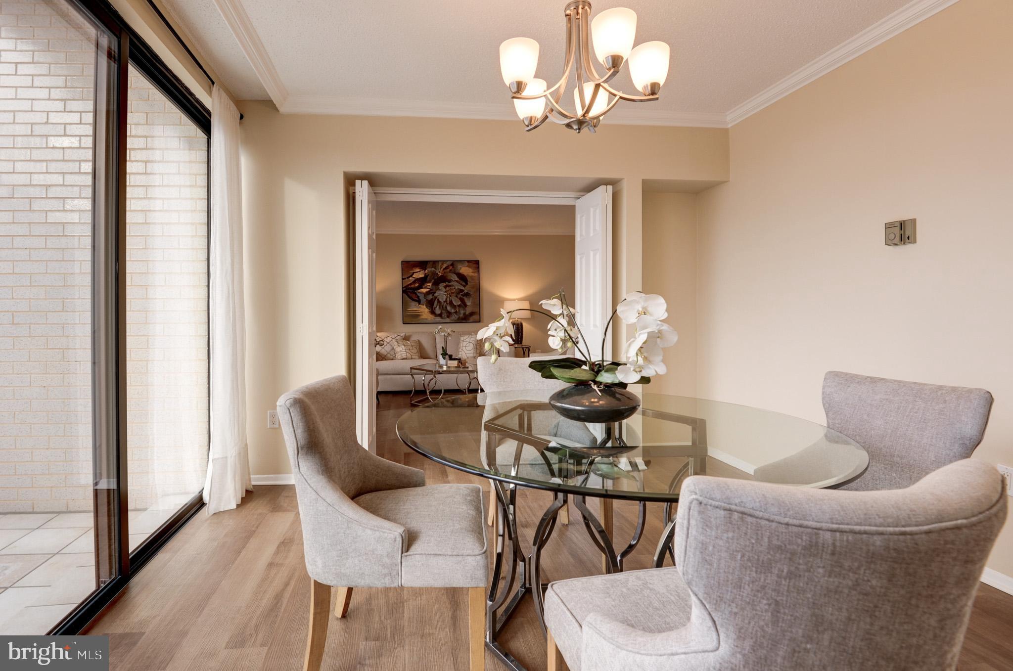4141 North Henderson Road, Unit 1218 Arlington, VA 22203 - Photo 11 of 50 Doors leading from dining room to living room