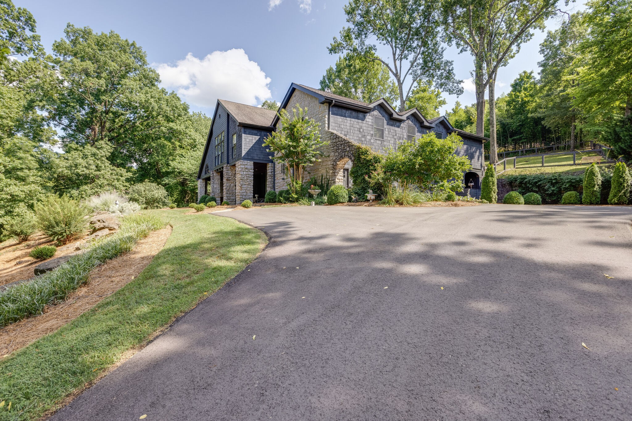 a front view of a house with a yard and a garage