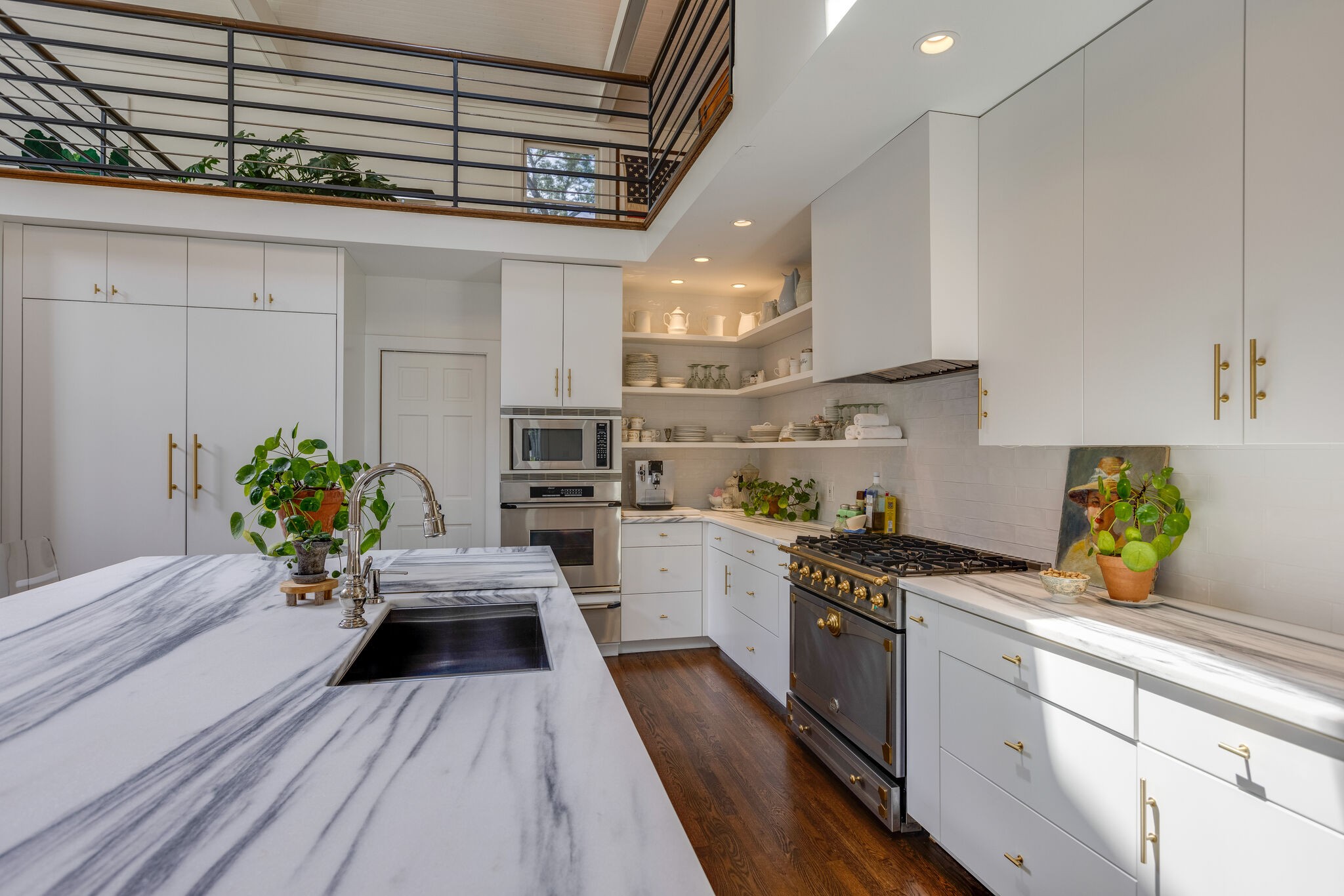 915 Overton Lea Road Nashville, TN 37220 - Photo 14 of 47 a kitchen with a sink stainless steel appliances and cabinets