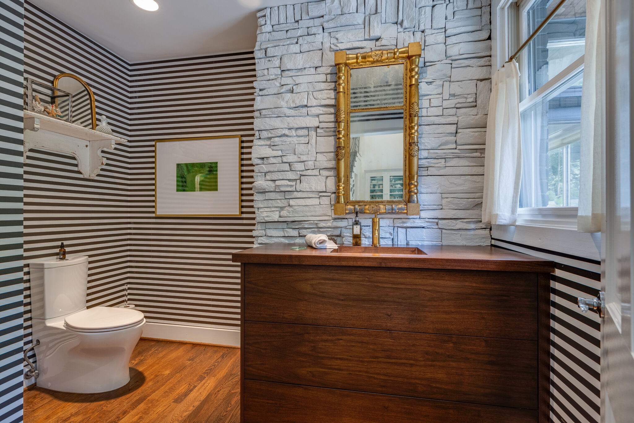 915 Overton Lea Road Nashville, TN 37220 - Photo 18 of 47 a bathroom with a sink a toilet and a window